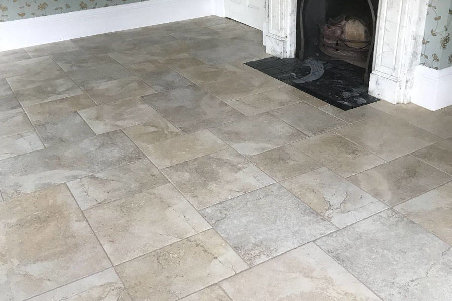 Porcelain Floor Tiles In Room With Decorative Marble Fireplace